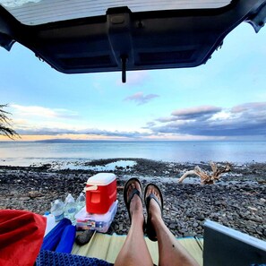 On the beach, sun loungers, beach towels