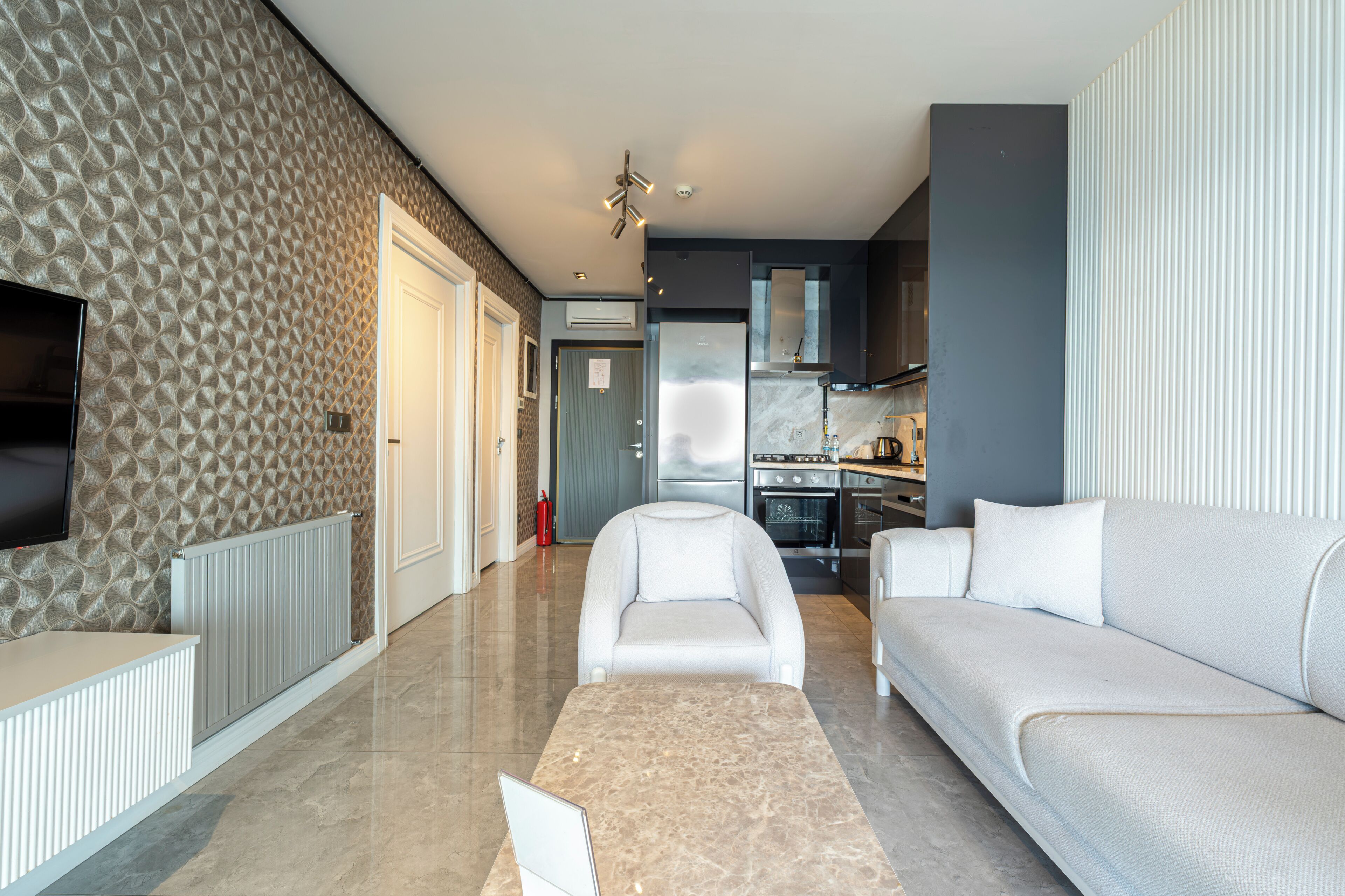 Suite ejecutiva, 1 cama King size, vista al mar | Sala de estar | Televisión LCD de 100 pulgadas con canales digitales 