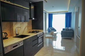 Comfort Suite, Sea View | Private kitchen | Fridge, oven, stovetop, dishwasher