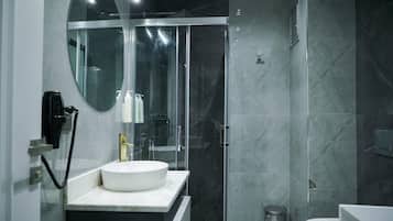 Separate bathtub and shower, free toiletries, hair dryer, slippers