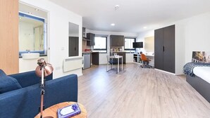 A modern apartment with a living room, kitchen, and dining area. - Student Only The Towpath (Chester)