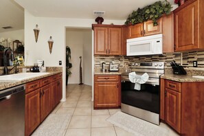 Fridge, microwave, oven, stovetop - 🌴 Florida Villa Near Disney | Southwest-Facing Pool & Private Fenced Yard (Kissimmee)