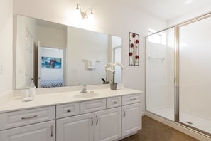 Shower, hair dryer, towels, soap
