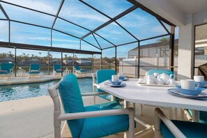 Outdoor dining - 6BR Lakeside Villa Near Disney | Southwest-Facing Pool, Hot Tub & Game Room (Kissimmee)