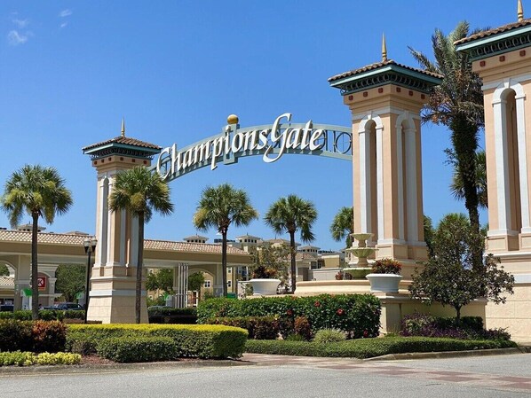 A hotel entrance with a prominent sign reading "ChampionsGate."