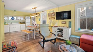 A compact living space with a kitchen, dining area, and seating area. - Walk to Private Bayside Beach! (Brewster)