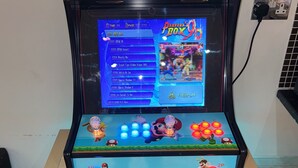 A gaming console with a Mario-themed display, a selection of games, and two storage drawers. - 1br-wifi-freesnacks-freeparking-petsok-retroarcade (Newcastle-upon-Tyne)