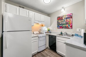 Fridge, microwave, oven, stovetop - Upper Westside Atlanta 2BR apartment with king beds, full kitchen, fast Wi-Fi, and free parking — close to dining, shopping, and MARTA. (Atlanta)