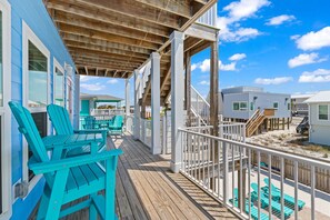 A wooden deck with turquoise chairs and a white railing overlooking a beach. - Amazing beach house, private heated pool and separate In-Law suite. (Navarre)