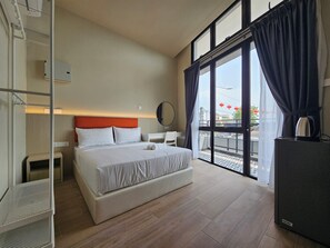 Deluxe Double Room, Balcony, Partial Ocean View | Desk, laptop workspace, iron/ironing board, free WiFi