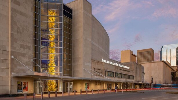 The Oklahoma City Museum of Art with a modern architectural design, featuring a prominent glass facade and a curved structure. - Affordable 2BR Getaway Near Plaza District Lilac1 (Midwest City)