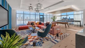 TV, fireplace, offices - Luxury Apartment with Rooftop Lounge & Gym (Boston, MA)