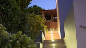 A staircase leading to a modern building with a view of the sky. - Marie Nicol Apartments Private Pool 3 Bedrooms (Malevizi)