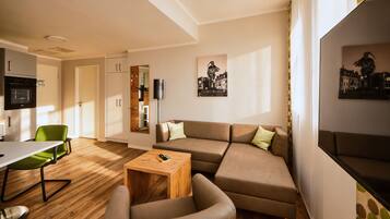 Superior Apartment | Living area | 42-inch Smart TV with satellite channels, Netflix, streaming services