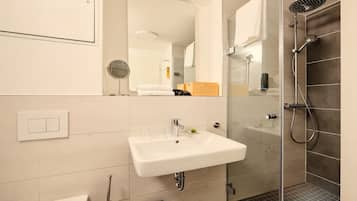 Shower, rainfall showerhead, hair dryer, towels