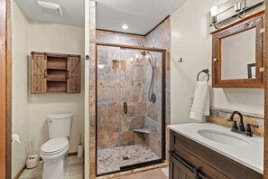 Shower, hair dryer, towels, shampoo