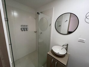 Shower, towels, soap, toilet paper