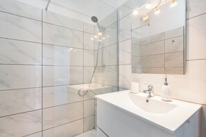 Shower, hair dryer, towels, soap