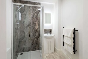 Shower, hair dryer, towels
