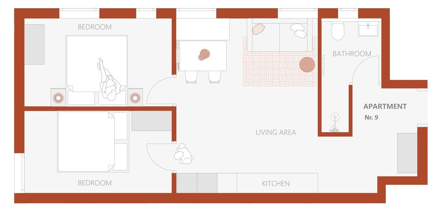 Un plan d’étage d’un appartement comprenant deux chambres, un salon, une cuisine et une salle de bain.