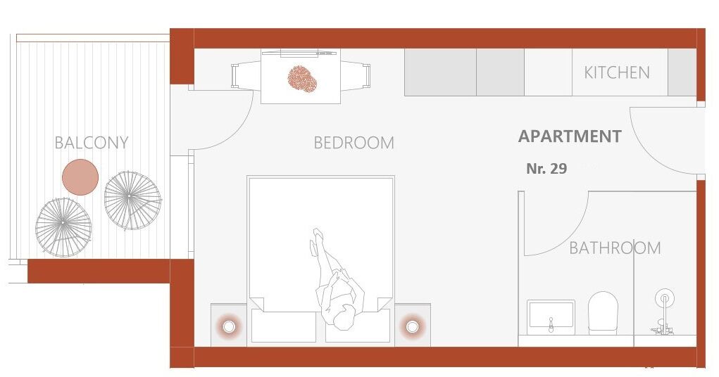 A floor plan of an apartment with a balcony, bedroom, bathroom, and kitchen.