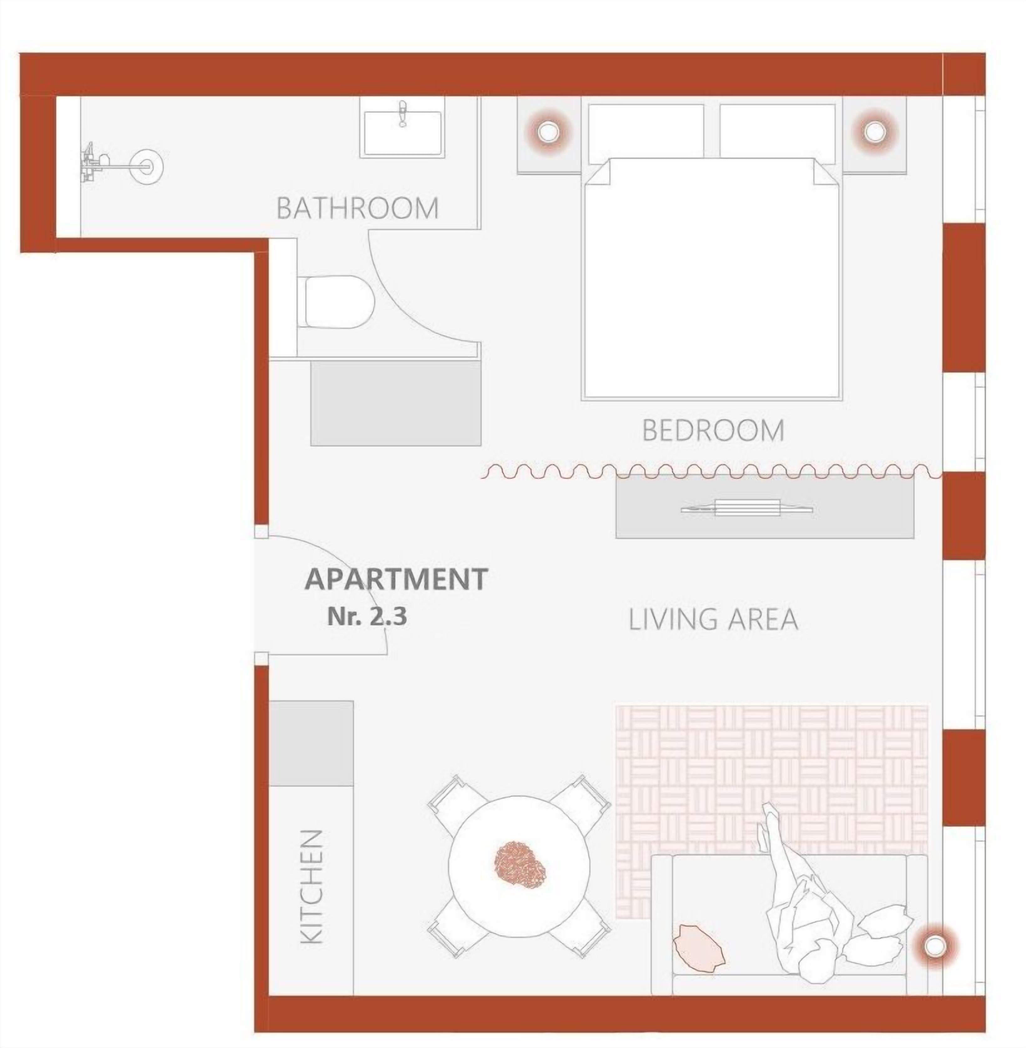 A floor plan of an apartment with a bathroom, bedroom, living area, and kitchen.