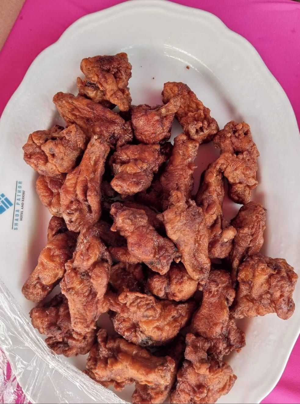 A plate of fried chicken pieces.