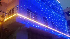 A building facade covered with blue LED lights.