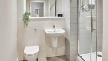 Shower, hair dryer, towels, shampoo