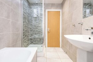 Shower, hair dryer, towels, shampoo
