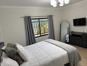 4 bedrooms, desk, iron/ironing board, travel cot