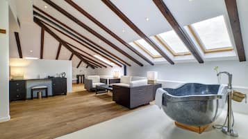 Deluxe Suite, 1 King Bed | Living area | TV
