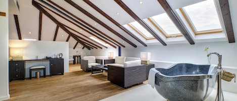 Deluxe Suite, 1 King Bed | Living area | TV