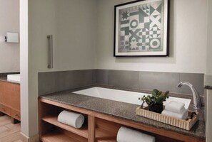 Shower, jetted tub, soap, toilet paper