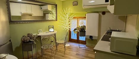 Microwave, stovetop, coffee/tea maker, cookware/dishes/utensils