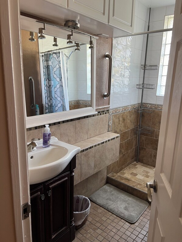 Shower, towels, soap, toilet paper