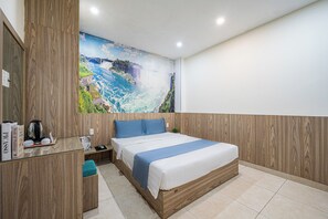 A bedroom with a large bed, a wooden headboard, a desk with a kettle, and a mural of a waterfall. - Cozrum - Love Hotel Trần Bình Trọng (Ho Chi Minh City)