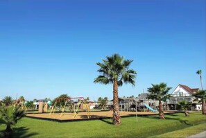 Enjoy a family-friendly stay with a playground and lush green surroundings.