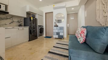 Deluxe Apartment | Living area | TV