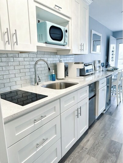 Stylish condo steps from the beach! Elegant blend of comfort and convenience.