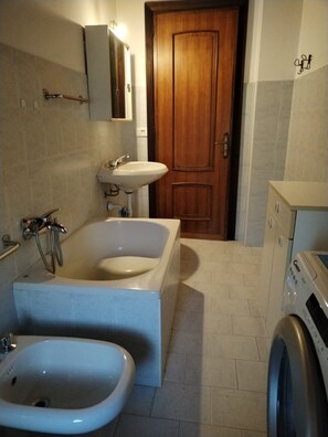 Bidet, soap, toilet paper