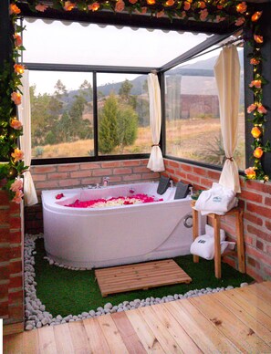 Jetted tub, towels, soap, toilet paper