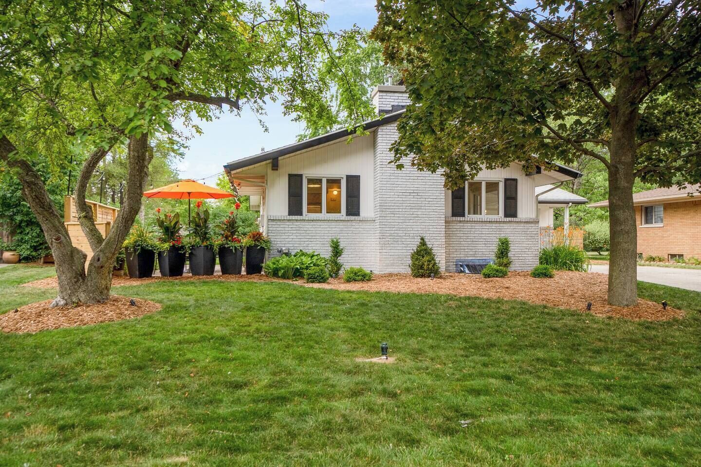 A single-story house with a brick exterior and a front porch.
