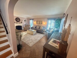 Smart TV, fireplace, books, printers