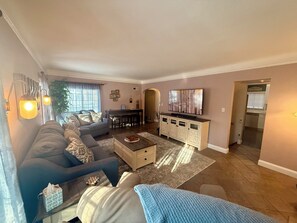 Smart TV, fireplace, books, printers