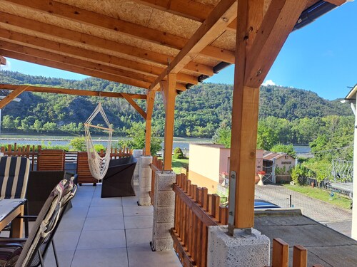 House on the Rhine with mountain views