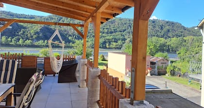 House on the Rhine with mountain views