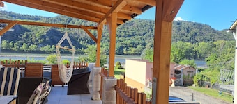 House on the Rhine with mountain views
