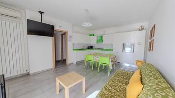 Apartment, Sea View | Private kitchen | Full-sized fridge, microwave, oven, stovetop