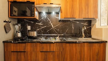 Departamento superior, vista al resort | Cocina privada